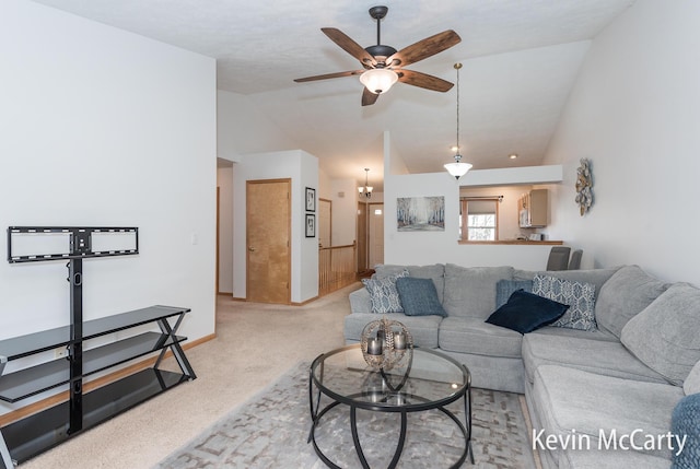 living room with light carpet, a ceiling fan, and lofted ceiling