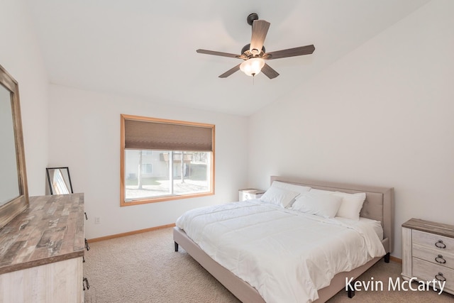 bedroom featuring baseboards, carpet floors, a ceiling fan, and vaulted ceiling