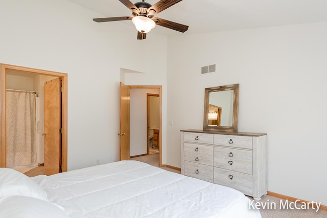 carpeted bedroom featuring visible vents, baseboards, high vaulted ceiling, and a ceiling fan