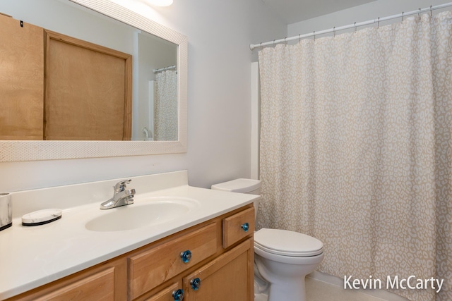 bathroom with toilet and vanity