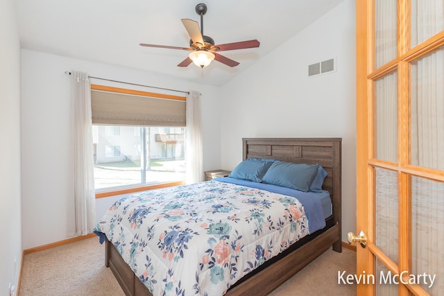 bedroom with visible vents, baseboards, lofted ceiling, and carpet floors