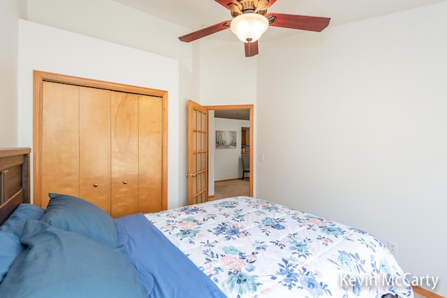 carpeted bedroom with a closet and a ceiling fan