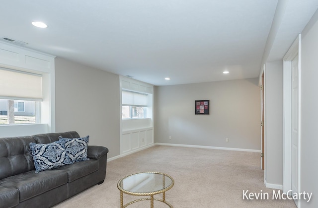 living room with recessed lighting, baseboards, visible vents, and light carpet