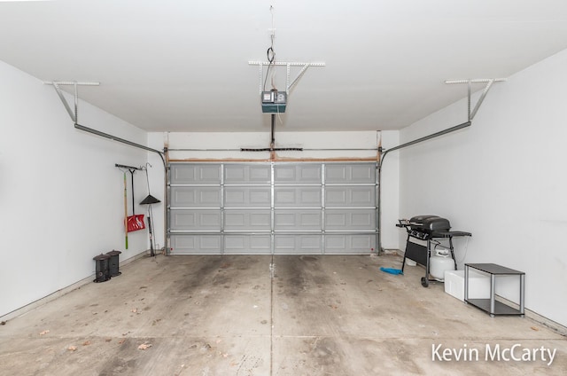 garage featuring a garage door opener