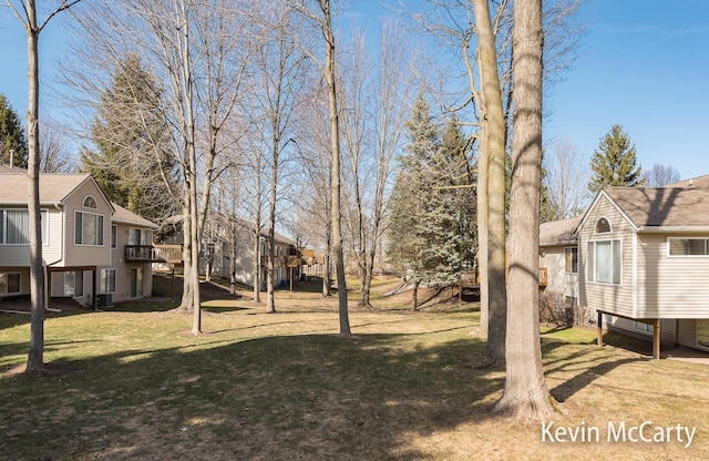 view of yard with a deck and a residential view