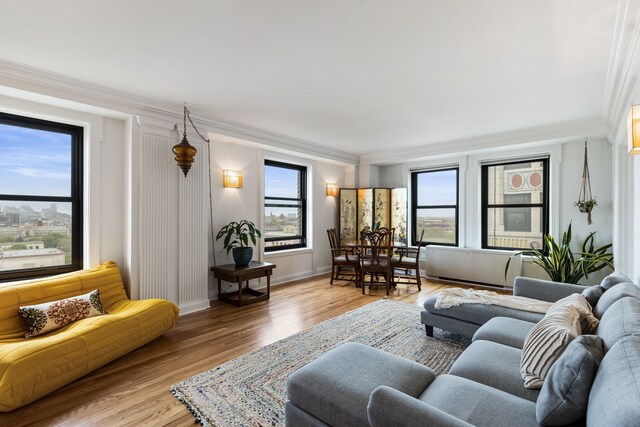 15 E Kirby St Unit 1104, Detroit, MI 48202 - living room with crown molding, light wood-style floors, and baseboards