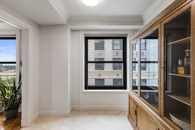 15 E Kirby St Unit 1104, Detroit, MI 48202 - doorway with crown molding and baseboards