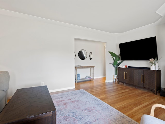 living room featuring light wood-type flooring and baseboards