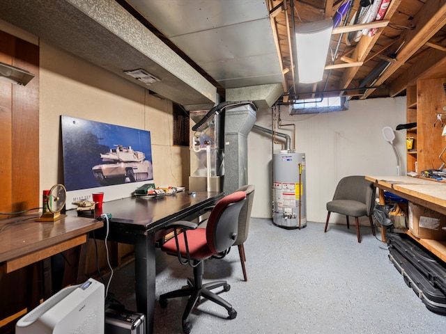 office with gas water heater, speckled floor, and a workshop area