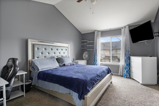 carpeted bedroom with ceiling fan and vaulted ceiling