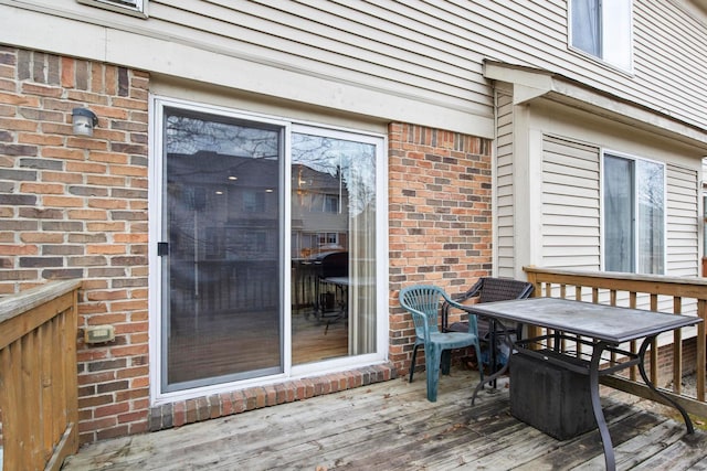 wooden deck with outdoor dining space