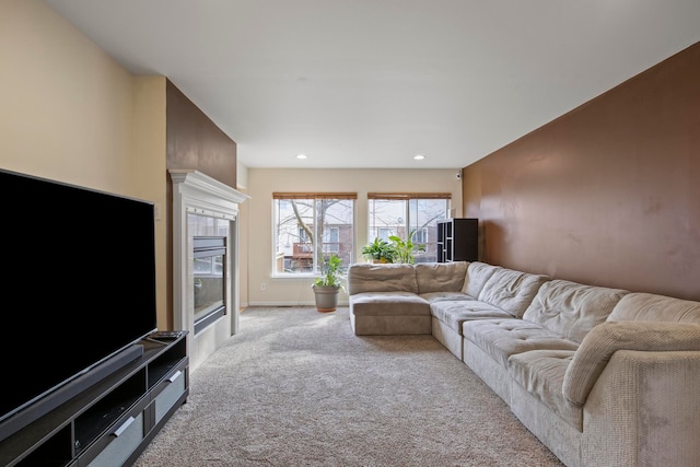 living area featuring recessed lighting, baseboards, light carpet, and a tiled fireplace