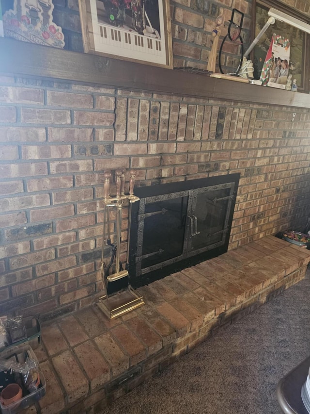 interior details with carpet flooring and a fireplace