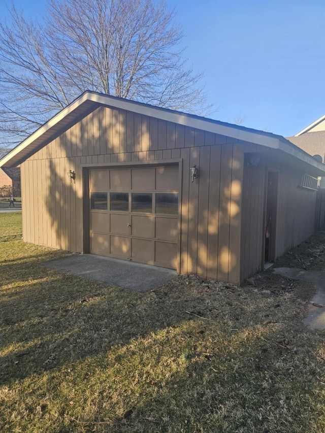 detached garage featuring driveway