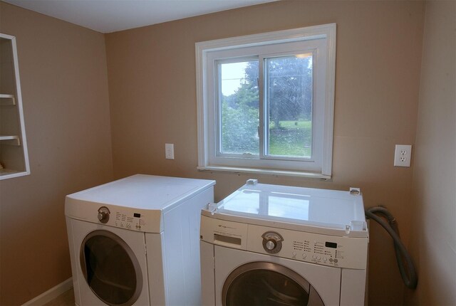 clothes washing area with laundry area and independent washer and dryer