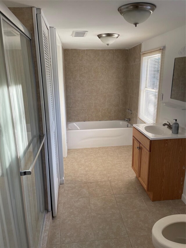 full bath featuring visible vents, toilet, vanity, and tile patterned flooring