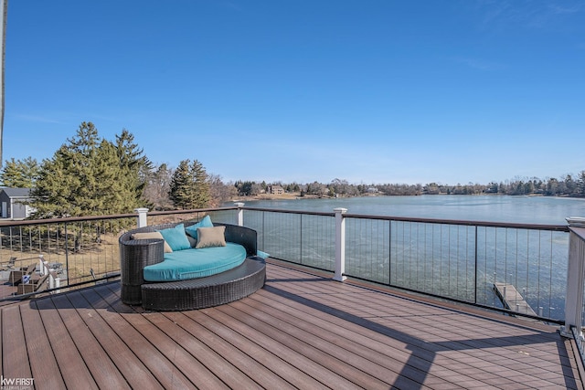 wooden deck with a water view