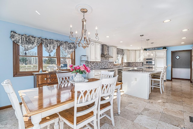 dining room with recessed lighting, baseboards, and plenty of natural light