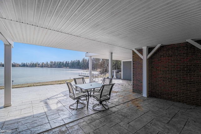 view of patio / terrace featuring outdoor dining area and a water view