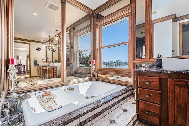 full bathroom featuring visible vents, vanity, crown molding, and a whirlpool tub