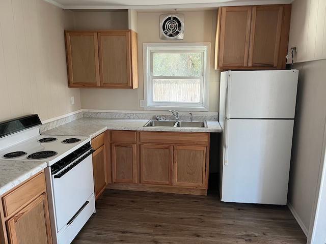 kitchen with visible vents, a sink, light countertops, white appliances, and dark wood-style flooring