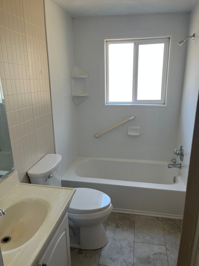 bathroom featuring toilet, shower / washtub combination, vanity, and tile patterned flooring