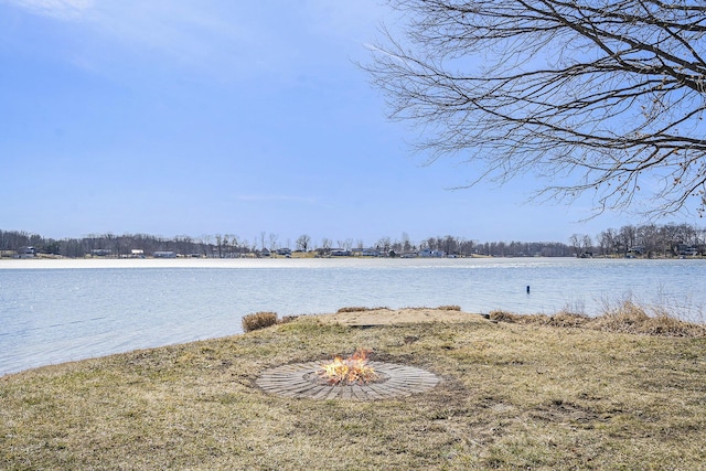 view of water feature with a fire pit