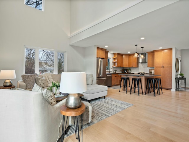 living room with recessed lighting and light wood-type flooring