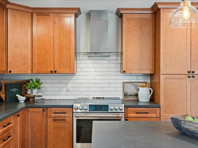 kitchen featuring dark countertops, electric range, wall chimney exhaust hood, and backsplash