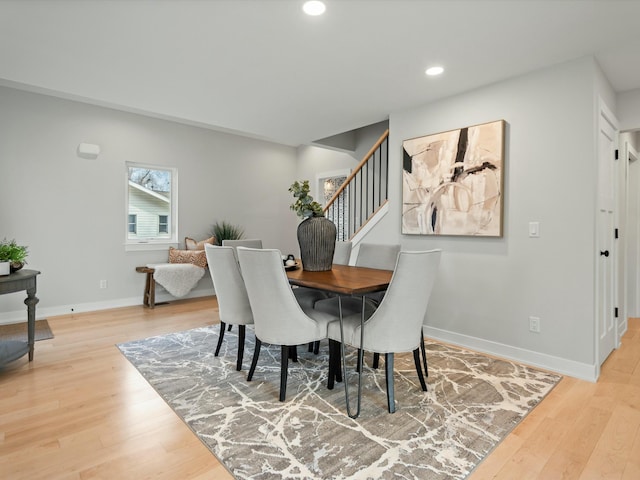 dining area featuring recessed lighting, stairway, baseboards, and wood finished floors