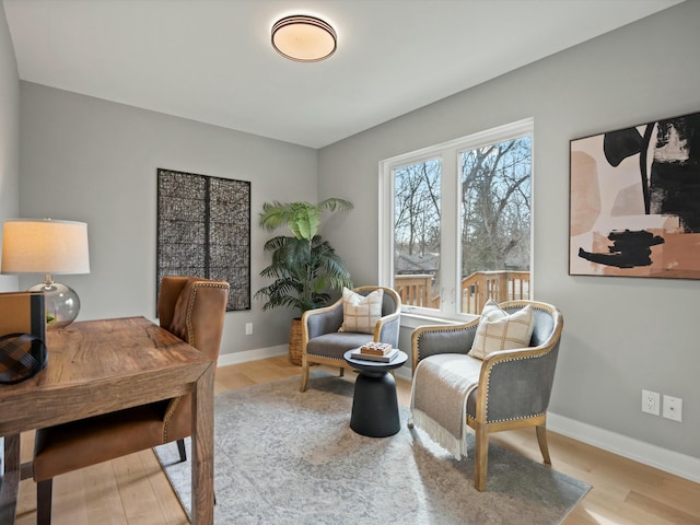 office with baseboards and wood finished floors