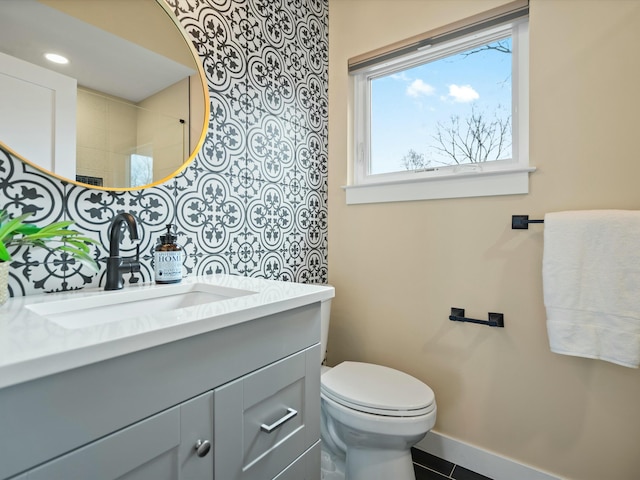 full bath featuring tile patterned floors, toilet, recessed lighting, baseboards, and vanity