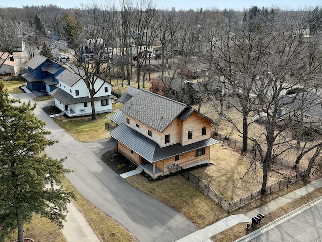 birds eye view of property with a residential view