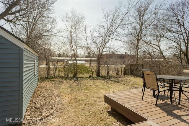 view of yard featuring outdoor dining space and fence private yard