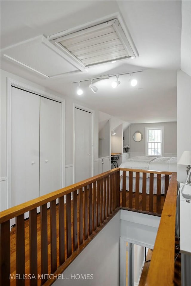 hallway featuring an upstairs landing