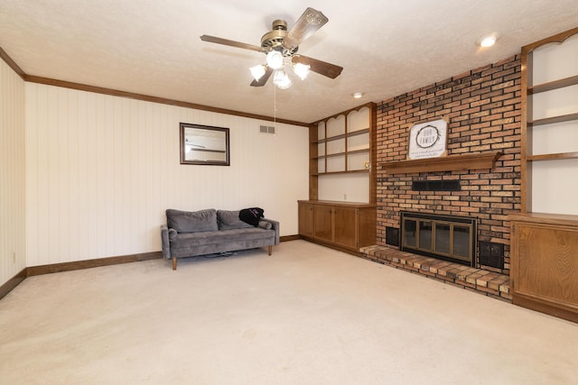 living area featuring visible vents, carpet, a fireplace, and a textured ceiling