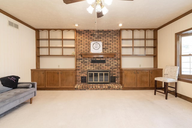 living area with a ceiling fan, visible vents, a fireplace, ornamental molding, and light carpet