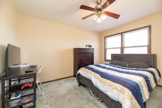 bedroom with baseboards, carpet floors, and a ceiling fan