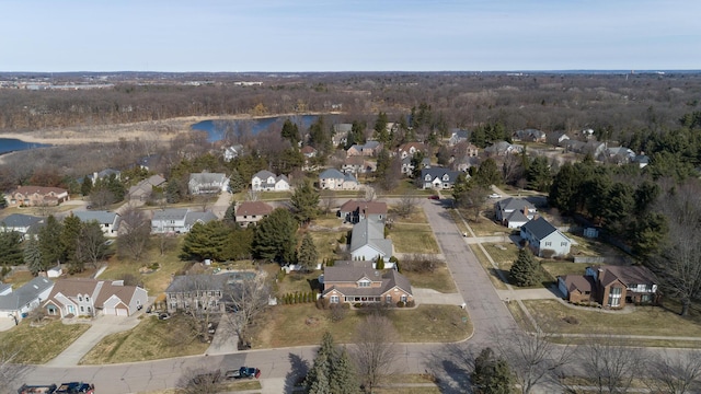 birds eye view of property with a residential view and a water view