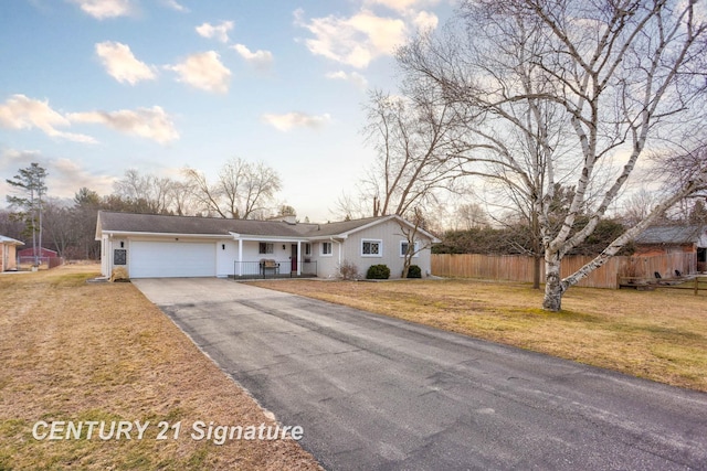 single story home featuring a front yard, fence, a garage, and driveway