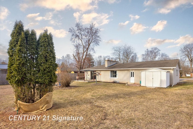 back of property with an outbuilding, a yard, brick siding, and a shed