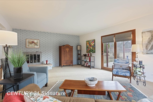 living area featuring a glass covered fireplace and light carpet