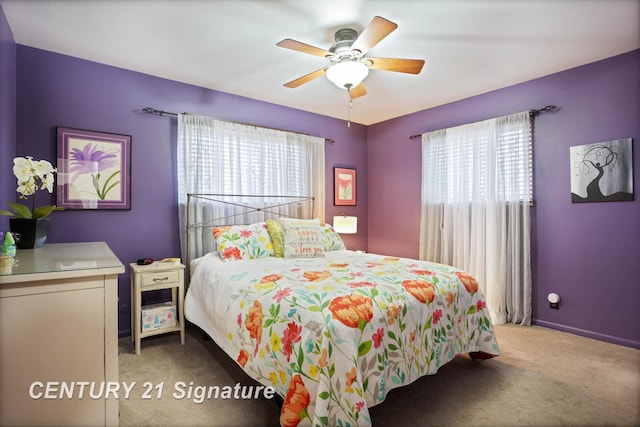 carpeted bedroom with baseboards and ceiling fan