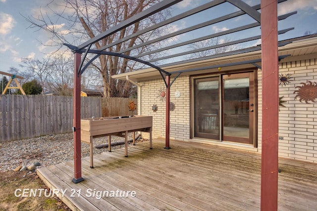 deck with fence and a pergola