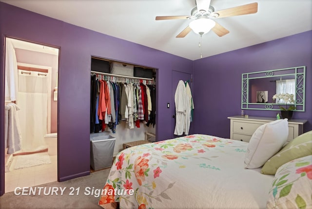 bedroom featuring a ceiling fan, a closet, and ensuite bathroom