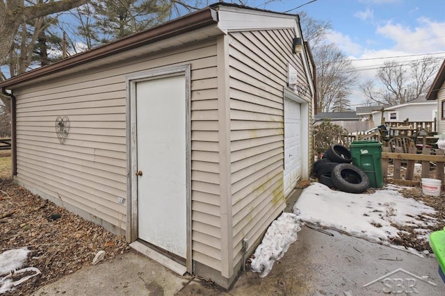 view of outbuilding with an outdoor structure and fence