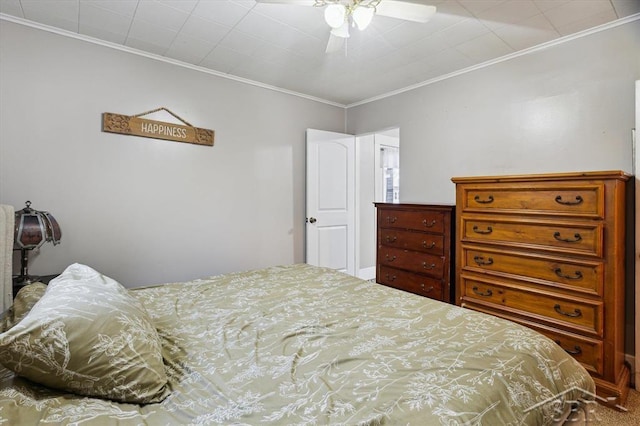 bedroom featuring ornamental molding and a ceiling fan