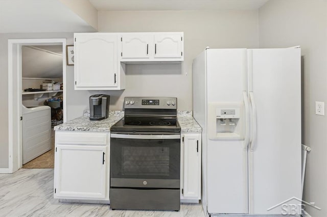 kitchen featuring washer / dryer, stainless steel range with electric stovetop, white refrigerator with ice dispenser, and white cabinets