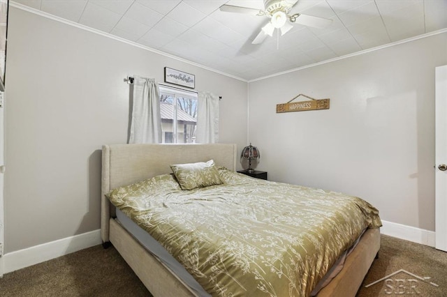 bedroom featuring baseboards, carpet floors, a ceiling fan, and crown molding