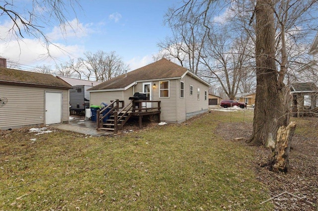 back of property with a deck and a lawn